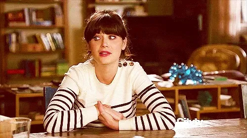 A woman sitting at a table.