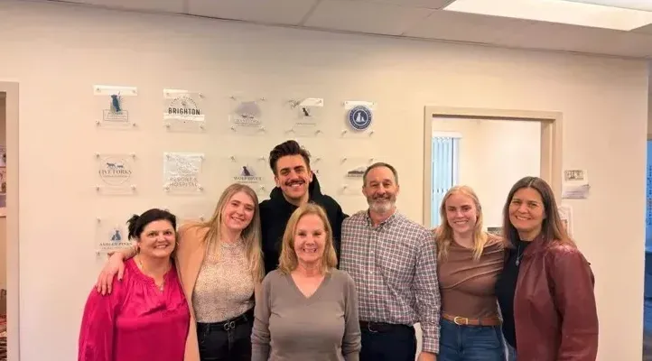 The SynergyVet team in their office during the Whale visit