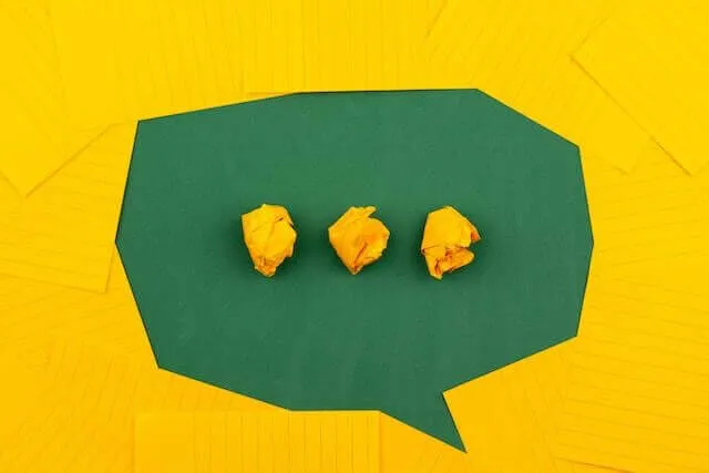 Three yellow crumpled pieces of paper containing SOPs and processes in a yellow speech bubble.