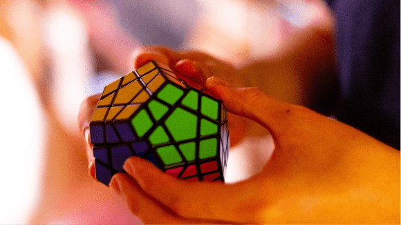 He once had motor skill challenges. Now he's the world's fastest Rubik's  cube solver