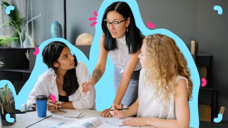 Three women reviewing SOPs together at a table.