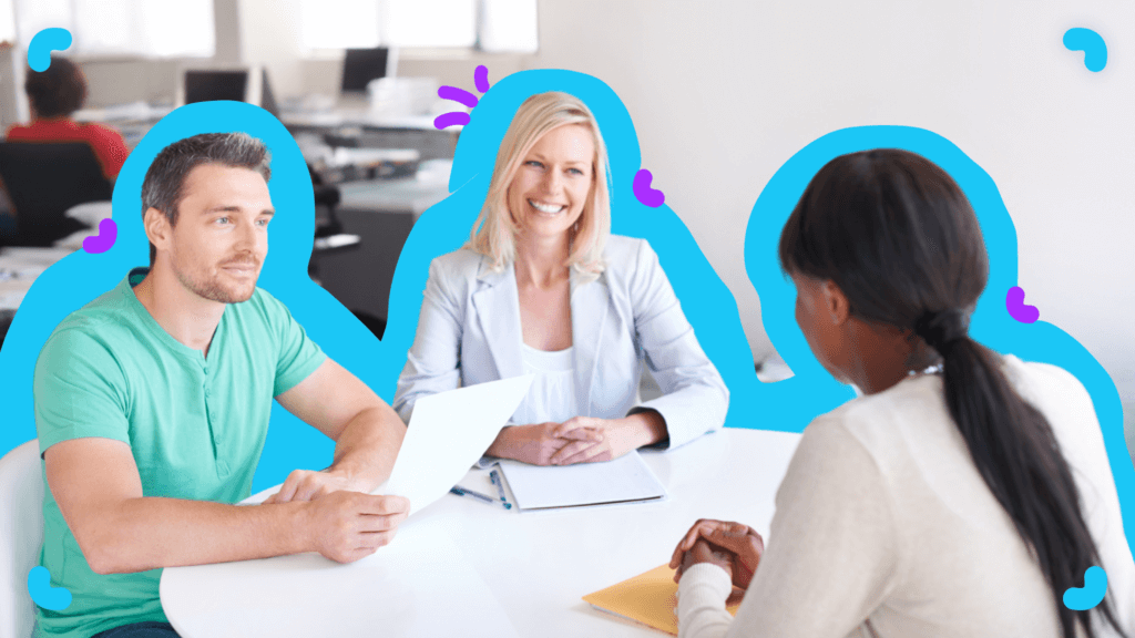 A group of people sitting at a table in an office during a client onboarding process.