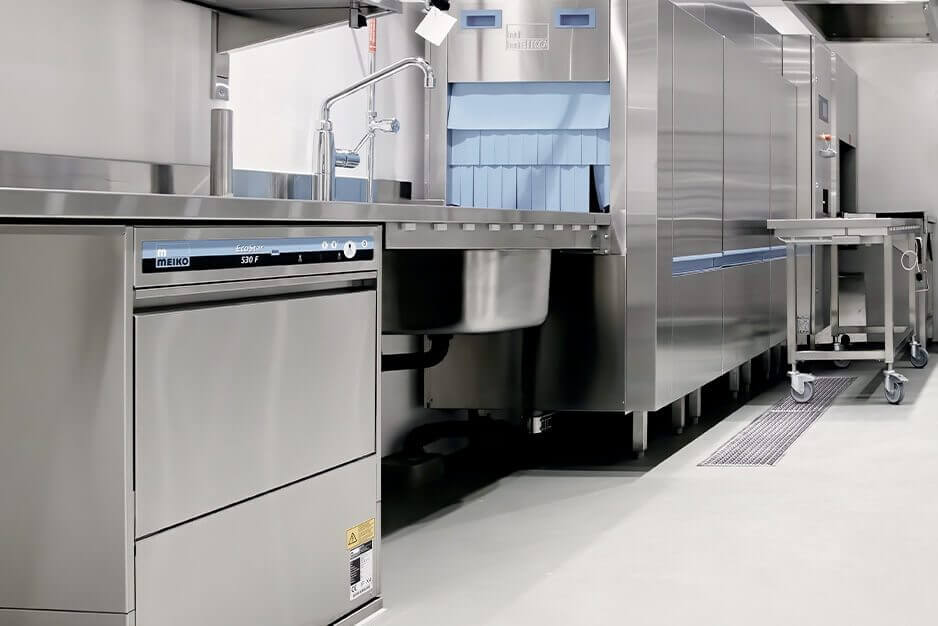 A commercial kitchen that follows strict procedures and processes in maintaining stainless steel appliances.