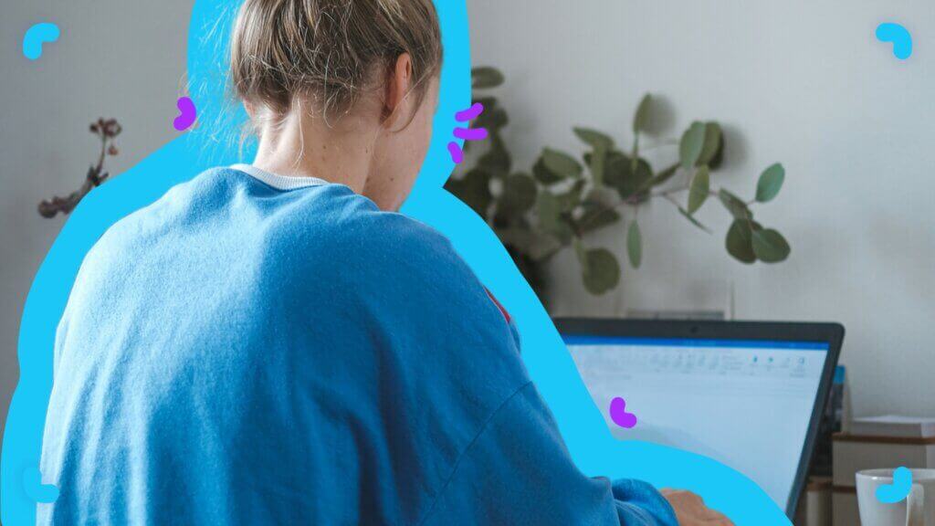 A woman is busy working on her laptop at home, focusing on communication.