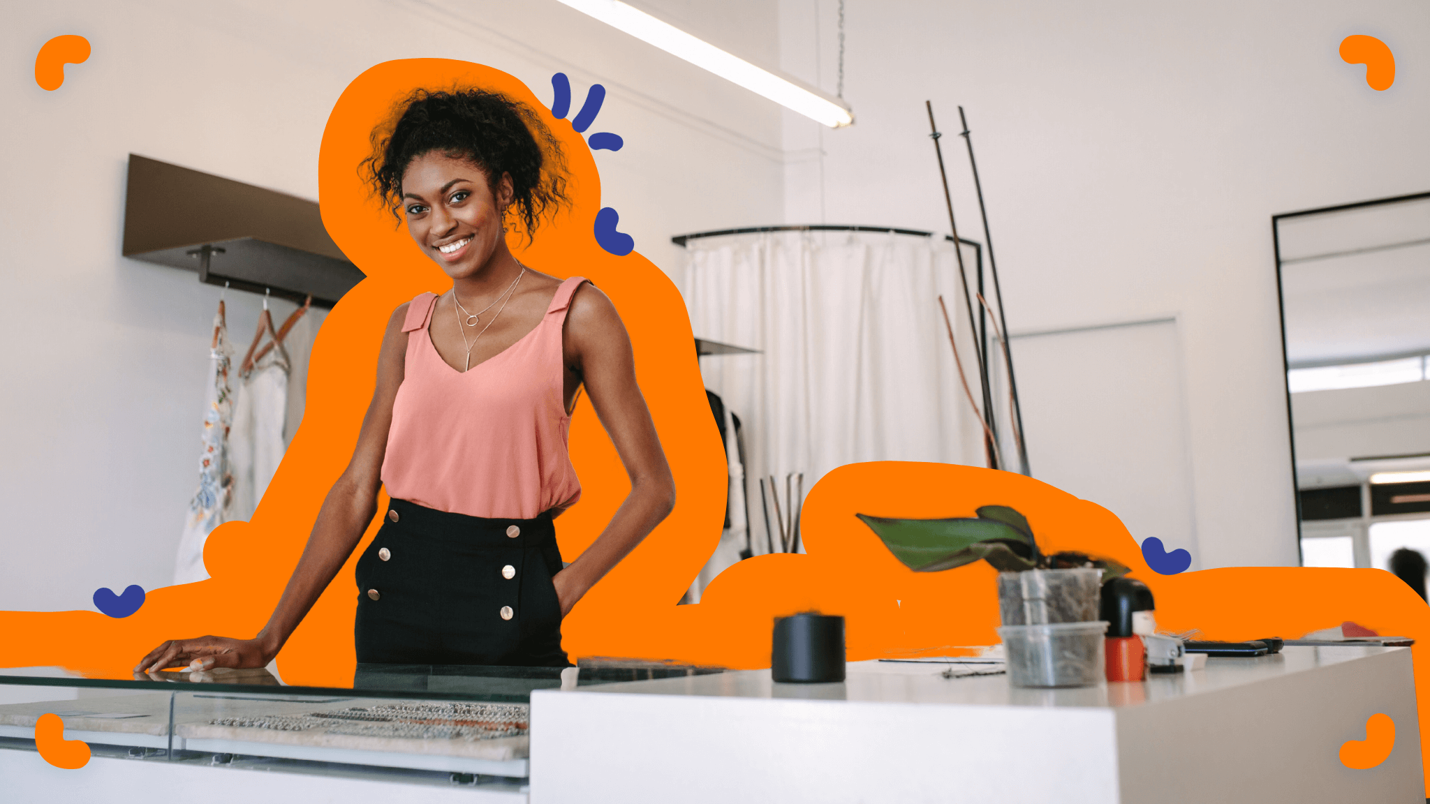 An entrepreneur stands in front of a jewelry store with an orange background.