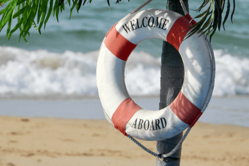 A life preserver on a beach, essential for safety and potentially requiring processes and documentation.