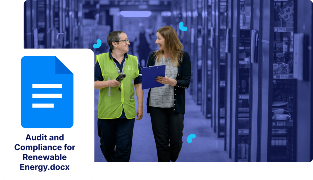 Two people walking and talking in a document storage area, discussing compliance. A digital icon displays the text "Audit and Compliance for Renewable Energy.docx" on the left.