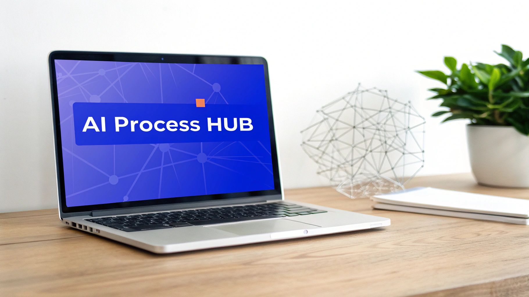 A laptop on a wooden desk displays 'AI Process HUB' on its screen, next to a geometric sculpture and a potted plant.